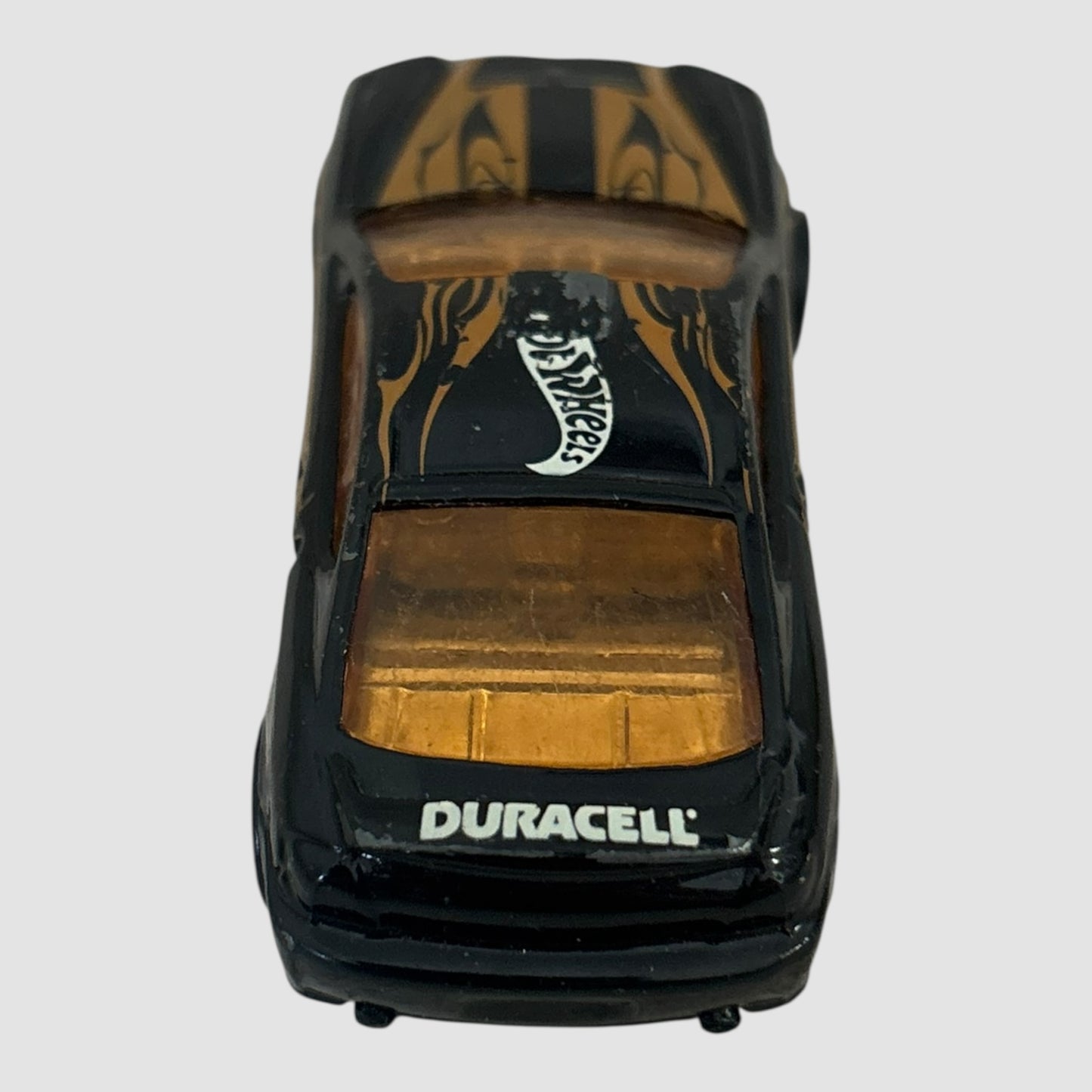 Carro miniatura Hot Wheels Hyundai Tiburon Duracell preto e dourado