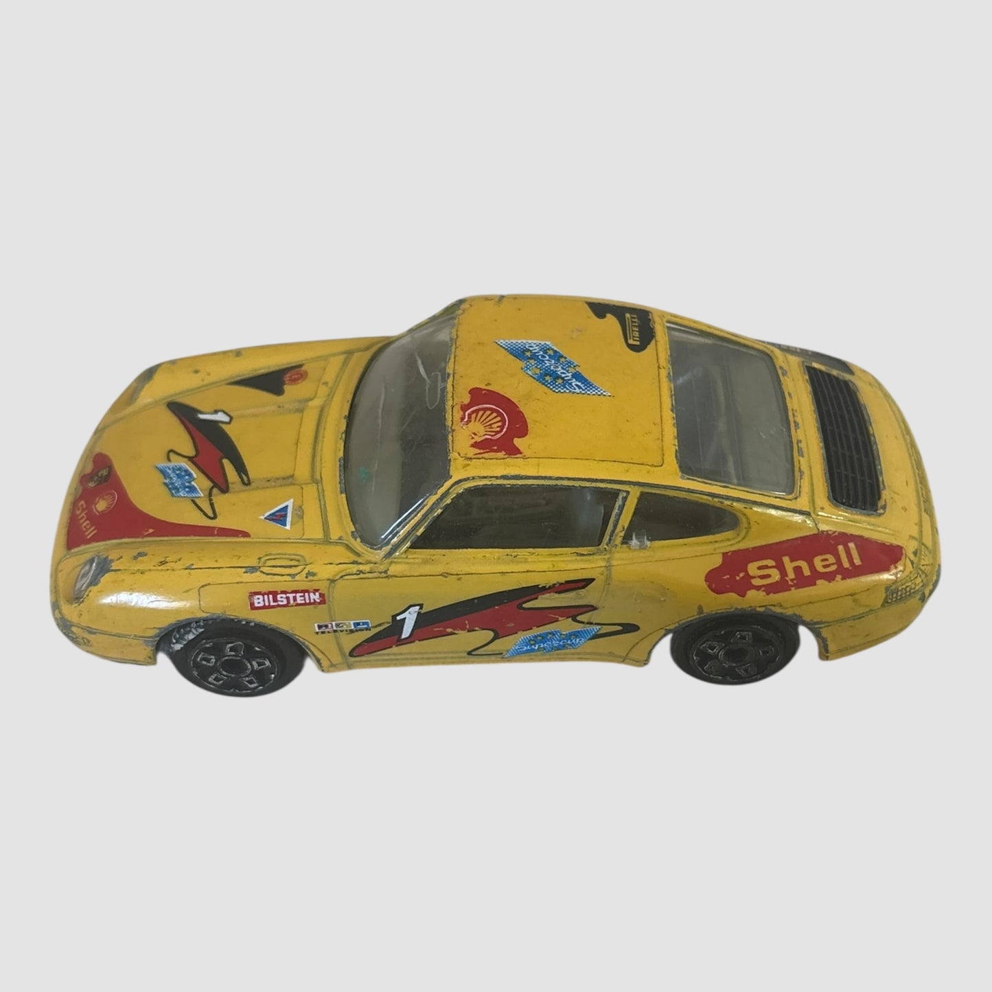 Bburago Porsche 911 Carrera miniatura amarela Shell